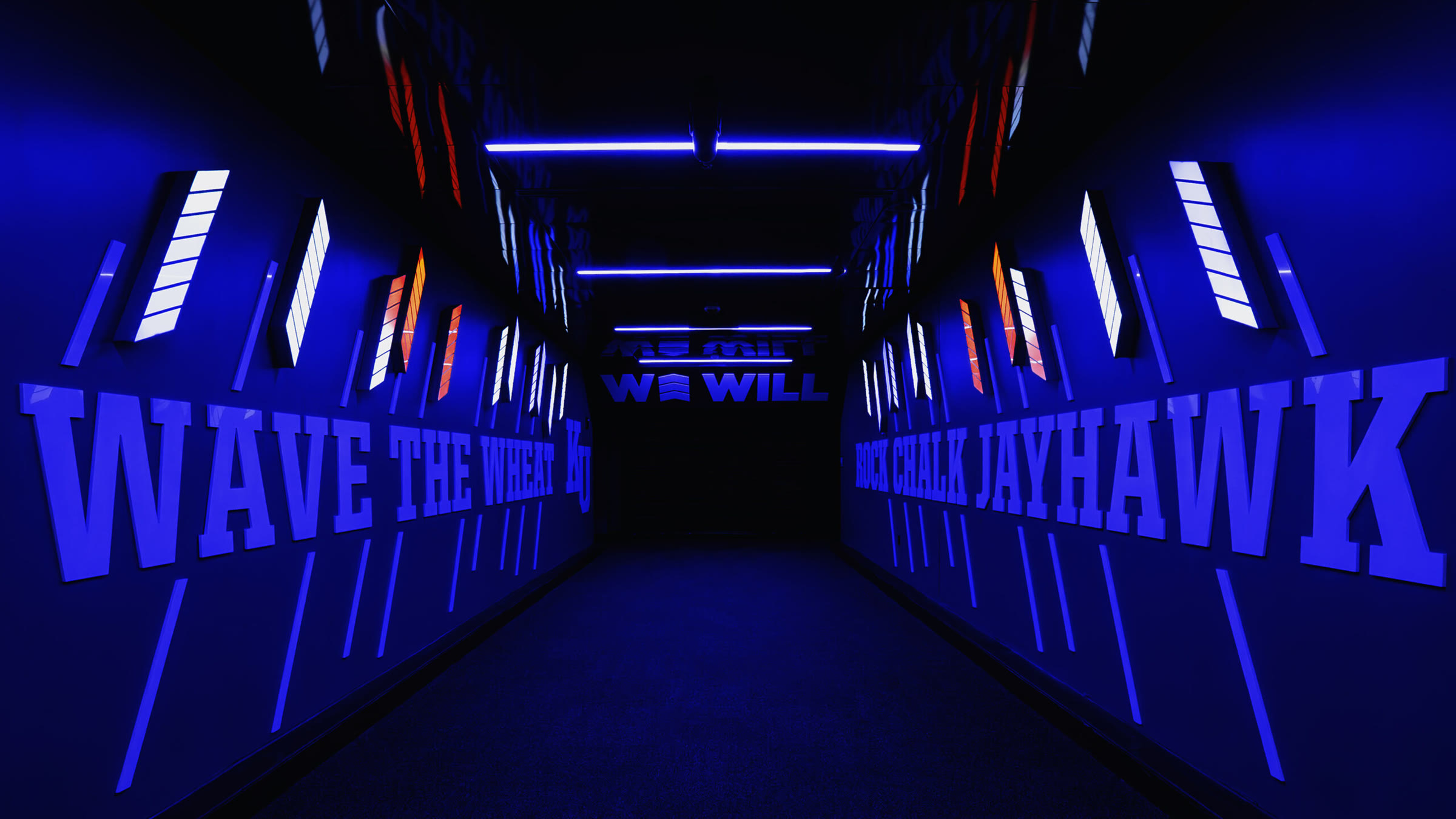 The same view in the blue state: letterforms and light batons in Kansas blue, the WE WILL sign still centered.